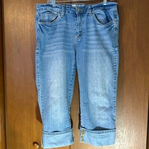 Baby Phat Capris.Size 11. Attached cuffs. Pockets front and back. Zip closure.